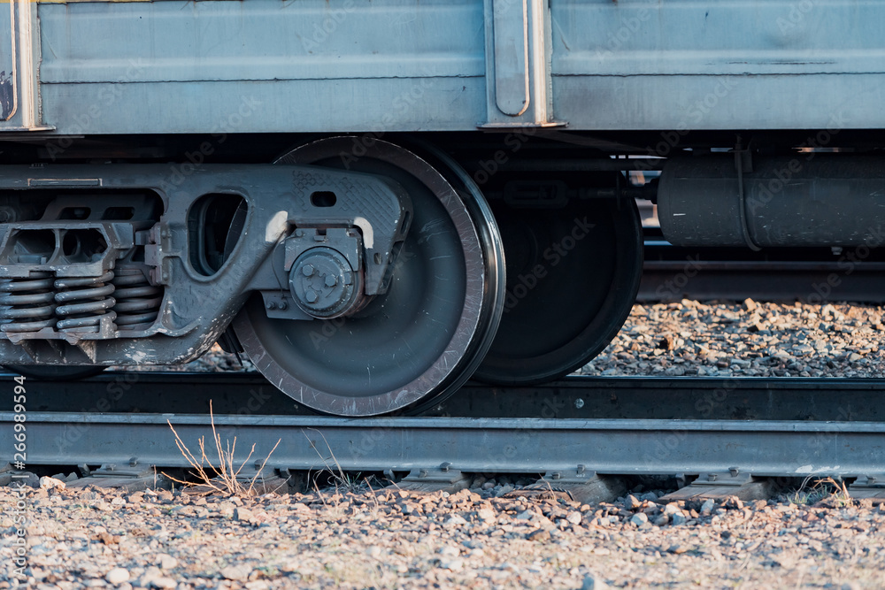 Railway carriage stands on the rails. Wagon wheels. Rails. Railway carriage stands on the rails. Wagon wheels. Rails.