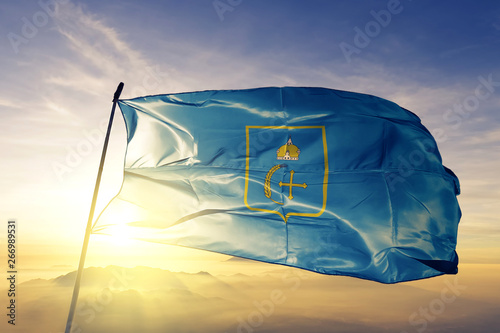 Sumy oblast of Ukraine flag waving on the top sunrise mist fog