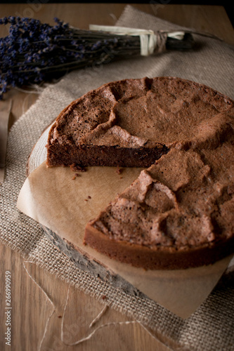 Beautiful delectable gluten free chocolate cake in a timber tabletop in the kitchen photo