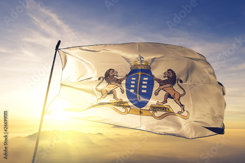 Gauteng province of South Africa flag waving on the top sunrise mist fog