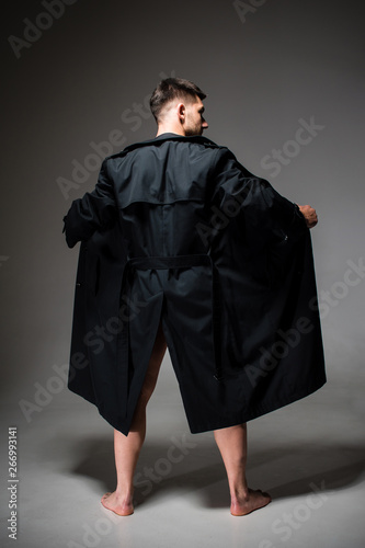 Fotografie Male exhibitionist opening up his raincoat to potential victim; concept of sexua