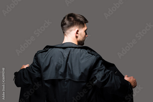Fotografie Dramatic closeup portrait of male exhibitionist opening up his raincoat to poten