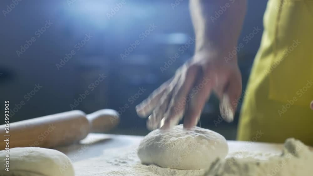 Chef hands preparing dough for pizza on table in kitchen 4K Chef hands preparing dough for pizza on table in kitchen 4K