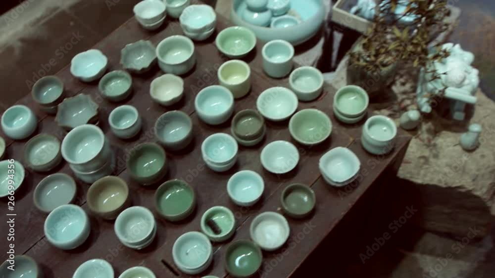 Many Chinese teacups in antique shop in Shanghai.A local seller of new and antique tea cups and tea sets. Many Chinese teacups in antique shop in Shanghai.A local seller of new and antique tea cups and tea sets.