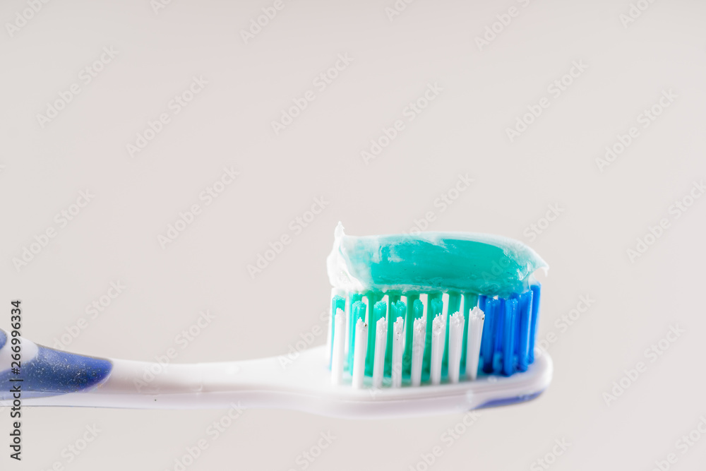 Toothbrush and Toothpaste on White Toothbrush and Toothpaste on White