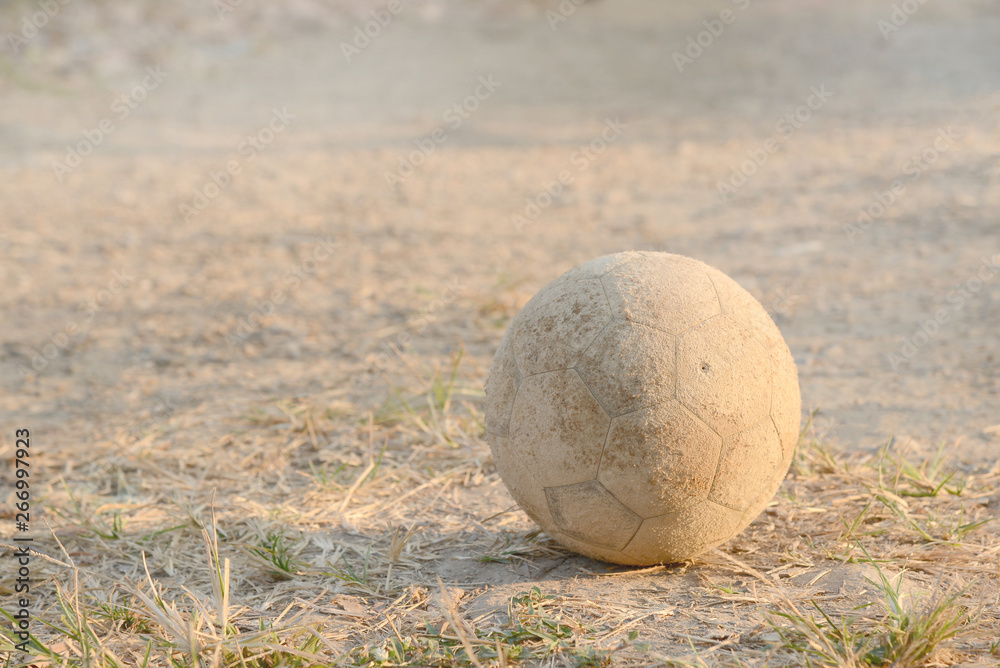 Old football on ground. Selective focus. Old football on ground. Selective focus.