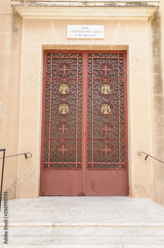 Metal door into a Greek Orthodox Church of Saint Nicholas photo