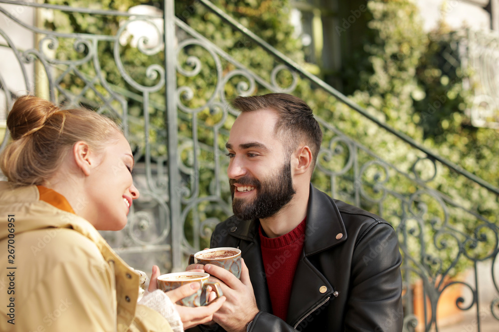 Lovely young couple enjoying tasty coffee outdoors Lovely young couple enjoying tasty coffee outdoors