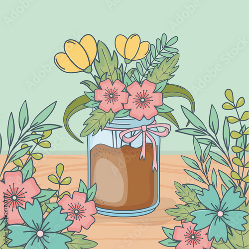 mason jar with floral decoration in wooden floor