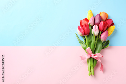 Fototapeta Naklejka Na Ścianę i Meble -  Beautiful bouquet of spring tulip flowers on color background, top view. Space for text