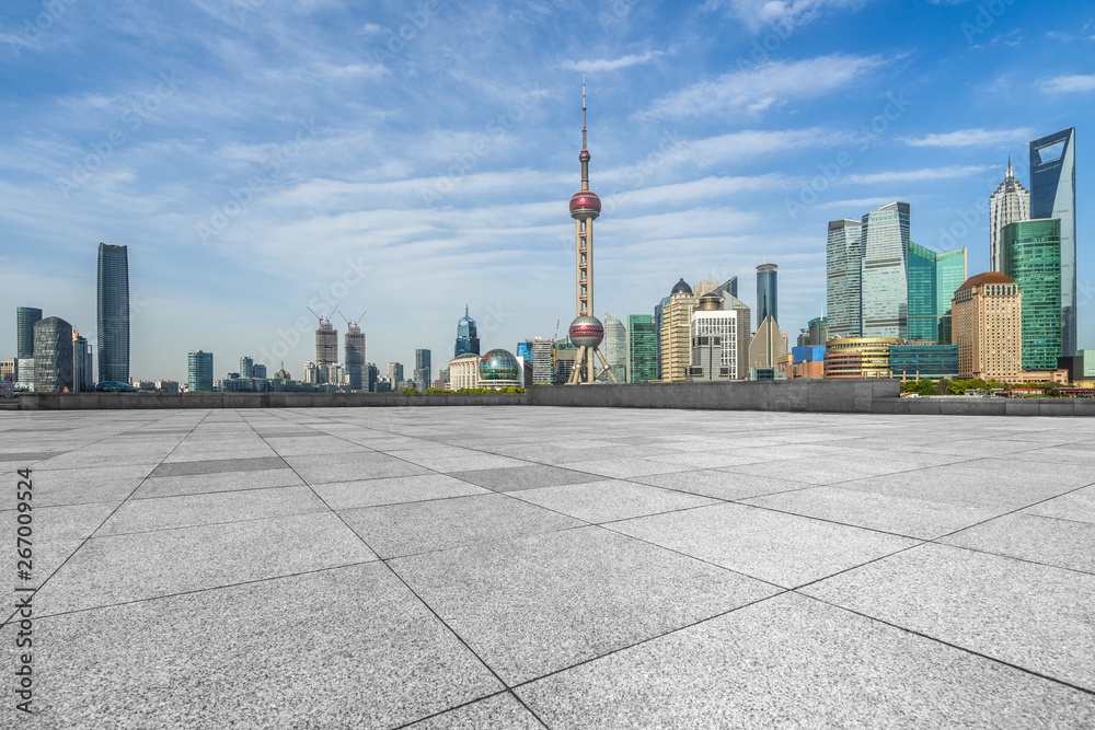 Fototapeta premium empty square and city skyline under blue sky, shanghai city, china.