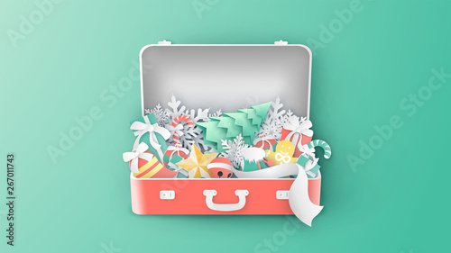 Creative design for Christmas with bell, ball, ribbon, snowflake, sock, gift box, gingerbread, star, candy cane, and Christmas tree. inside suitcase. paper cut and craft style. vector,illustration.