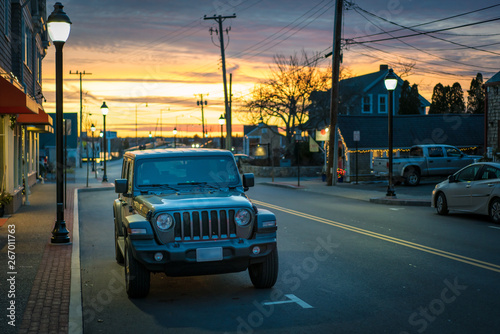 Beautiful sunset over popular street in Cape Town Massachusetts, beach town harbor 