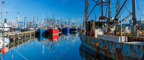 Landscape panoramic view of Commercial phishing boats harbor, repair shop