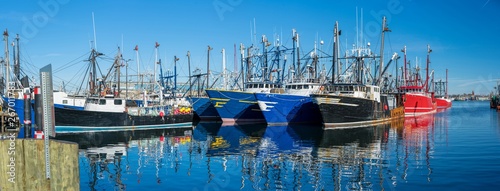 Landscape panoramic view of Commercial phishing boats harbor, repair shop