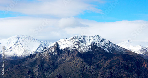 Panorama of snowy mountains and blue sky © Marco Tulio