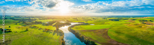 Aerial panoramic landscape of scenic sunset over river and grasslands in Australia