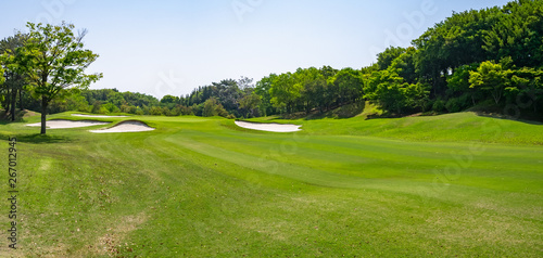 Panorama view of Golf Course with beautiful green field. Golf course with a rich green turf beautiful scenery.	