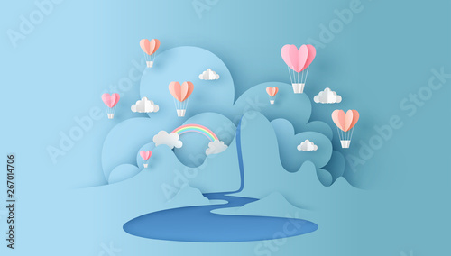 Abstract of nature landscape view scene with cloud, pond, rainbow and heart shape hot air balloons float up on sky. paper cut for valentine's day. paper cut and craft style. vector, illustration.