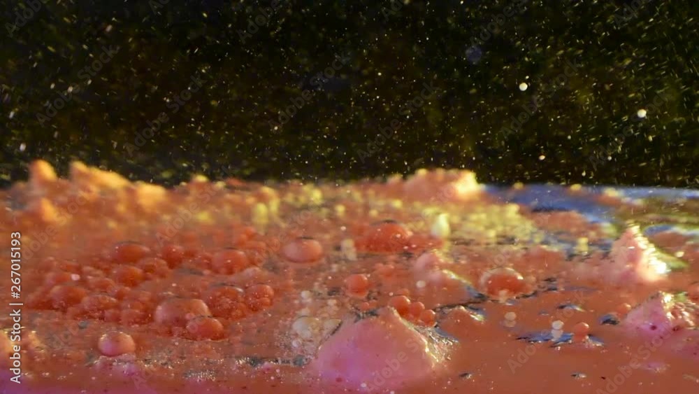 alien planet liquid surface stirring oil and color loops and swooshes ...