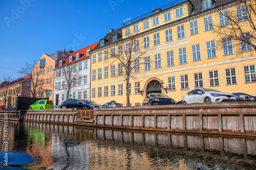 city scene with houses along water canal 