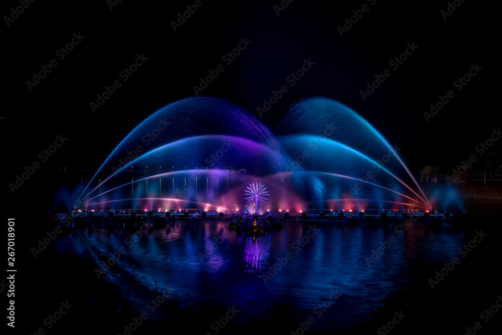 The colorful fountain dancing in celebration festival with dark night sky background.