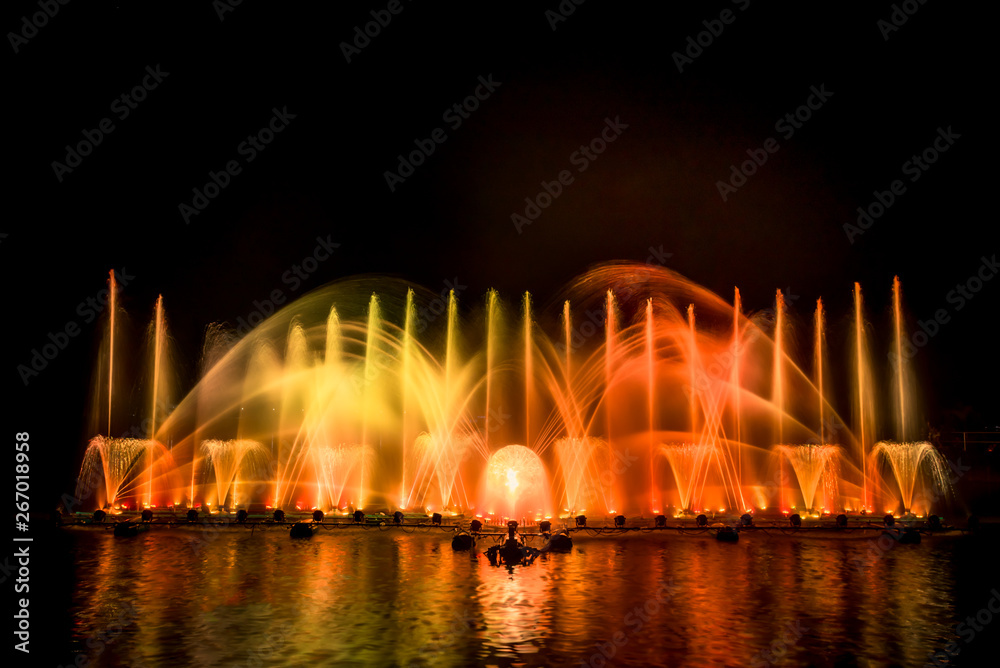 The colorful fountain dancing in celebration festival with dark night sky background.