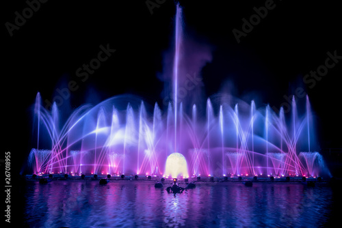 The colorful fountain dancing in celebration festival with dark night sky background.