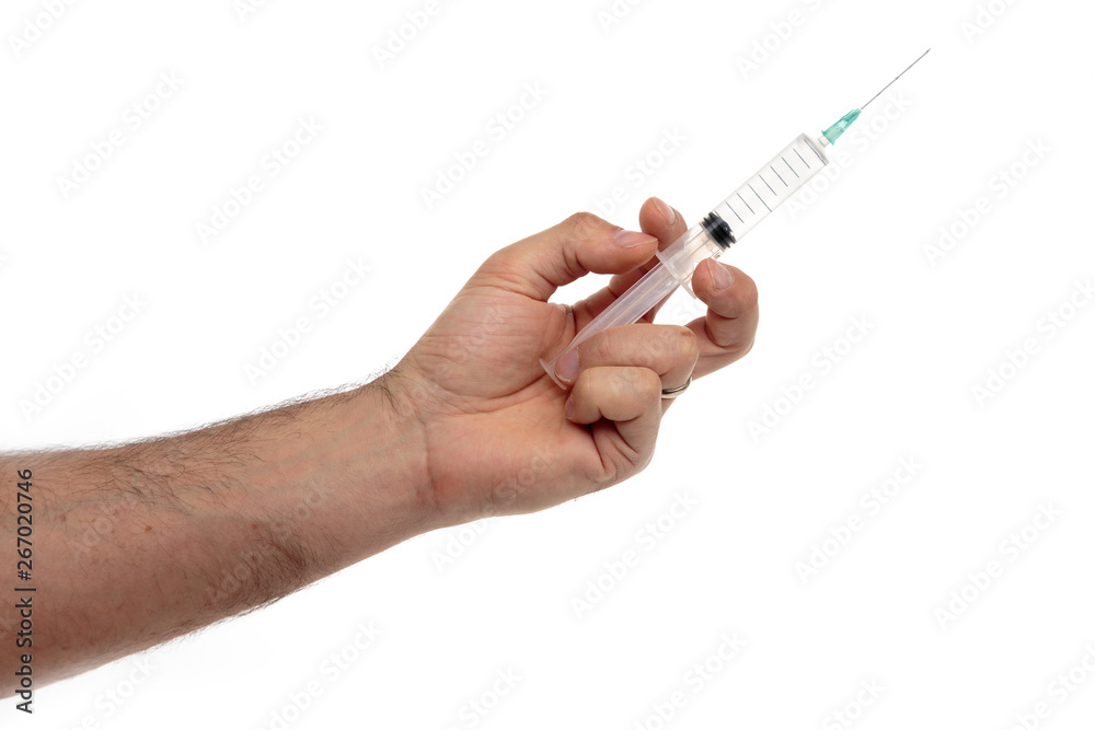 Male hand with a syringe with clear liquid isolated on white Male hand with a syringe with clear liquid isolated on white