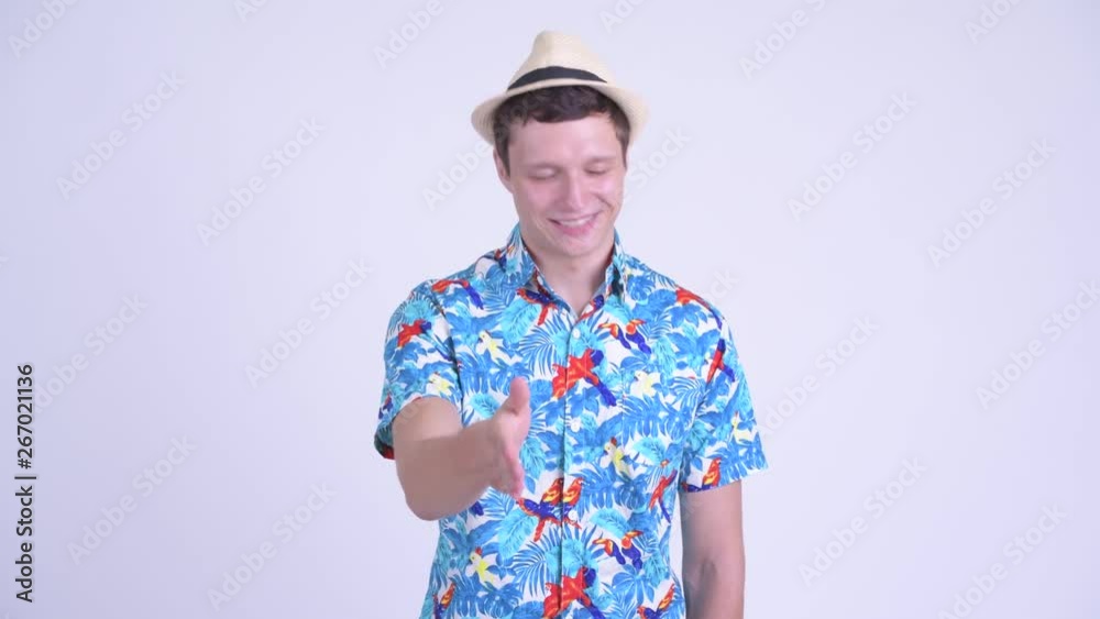 Happy young handsome tourist man giving handshake Happy young handsome tourist man giving handshake