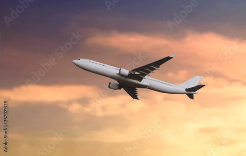 Passenger airplane flying during sunset