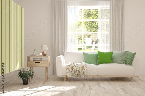 Stylish room in white color with sofa and summer landscape in window. Scandinavian interior design. 3D illustration