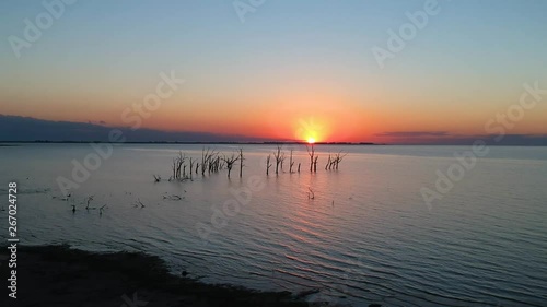 Warm sunset in the Ansenuza lagoon, Cordoba, Argentina. photo