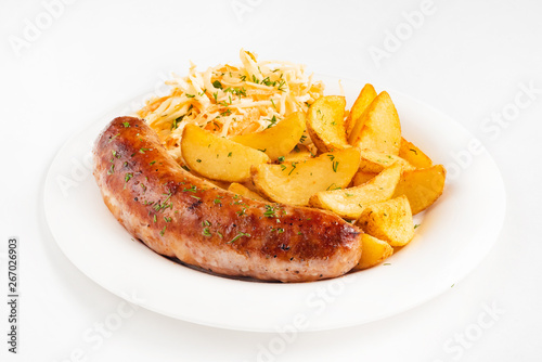 sausage with fried potatoes and salad