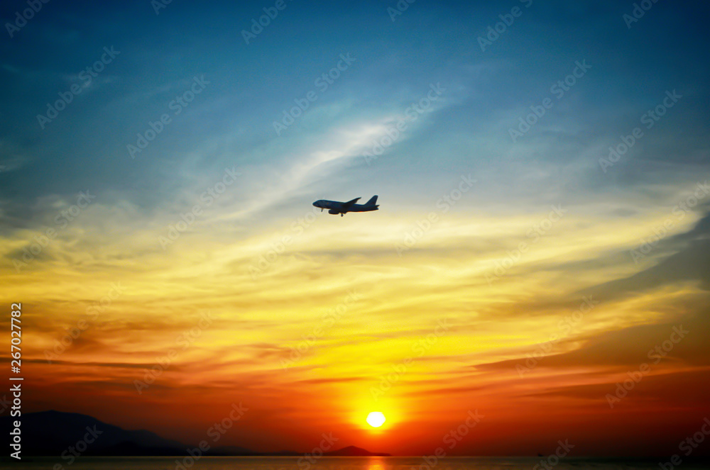 beuatiful of colorful  sunset background with airplane