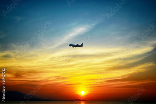 beuatiful of colorful sunset background with airplane