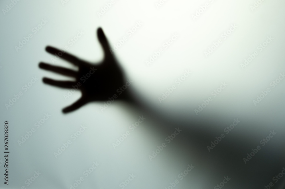 Blurred children's hand. Abstraction on a gray background. Blurred children's hand. Abstraction on a gray background.