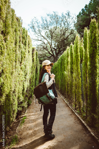 Canvas Print Young woman walking in the park labyrinth
