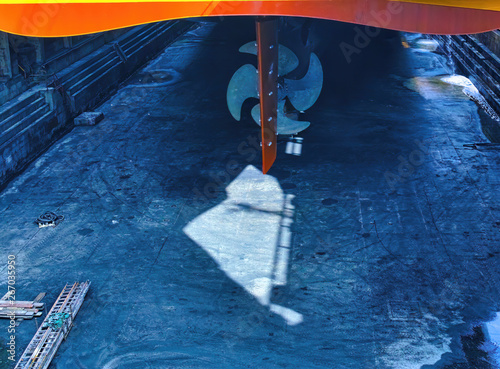 big yellow roro vessel inside a dry dock for repair