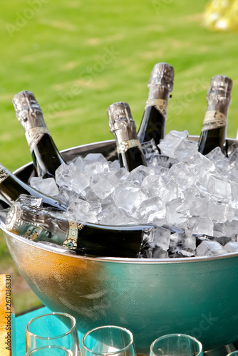 glass of champagne and ice on table