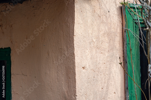 Corner of an old, carelessly painted village house photo