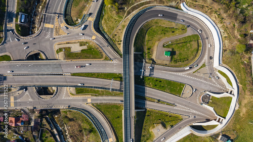 Aerial photography. Exit from the underground tunnel. Bypass road. Transport ring. Multi-level road junction. Alternate of Kurortny Avenue, Sochi. Top view on a Sunny day.