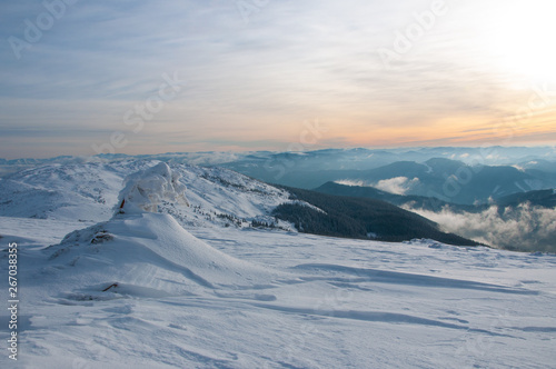 Amazing landscape in the winter mountains at sunrise © plysuikvv
