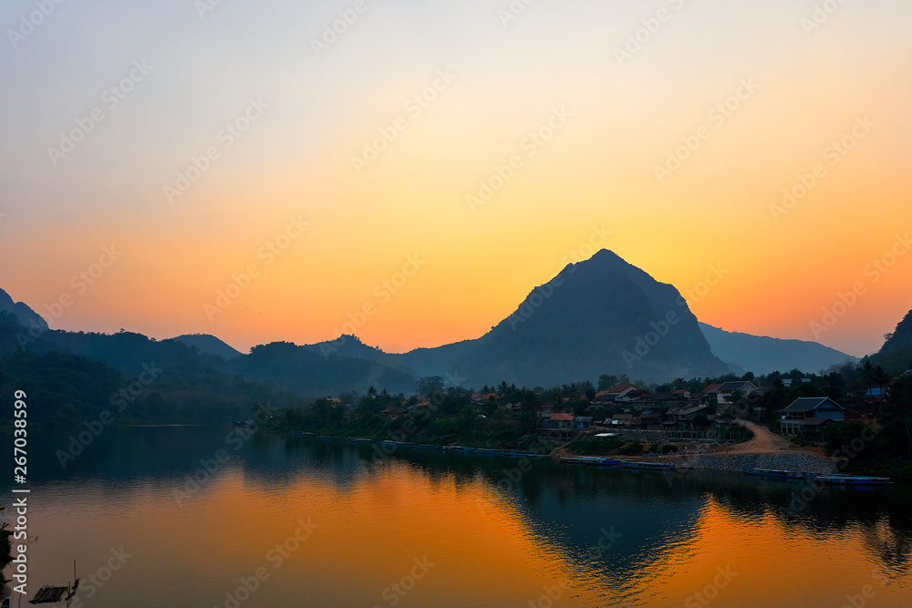 House at the River , Sunset on the Nam Ou River in Nong Khiaw, Laos