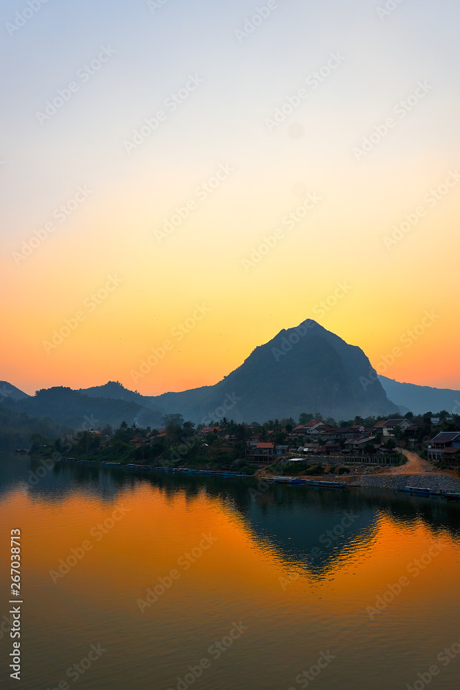 House at the River , Sunset on the Nam Ou River in Nong Khiaw, Laos