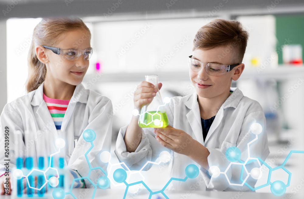 education, science and children concept - kids with test tubes studying chemistry at school laboratory education, science and children concept - kids with test tubes studying chemistry at school laboratory