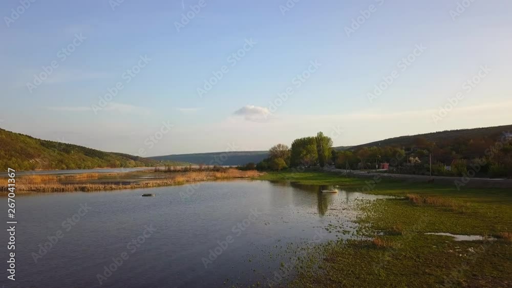 Arial view over the river and small village. Dniester river of Moldova republic. Arial view over the river and small village. Dniester river of Moldova republic.