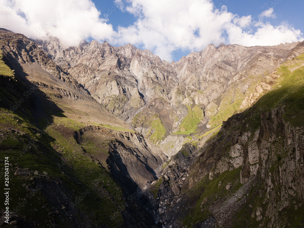 Aerial view from drone to mountains with ravine and fracture near mountain Kazbegi in Georgia