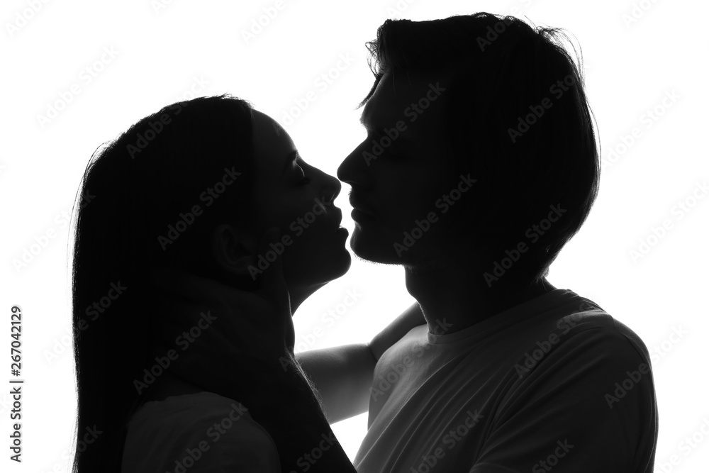 Silhouette of young couple on white background
