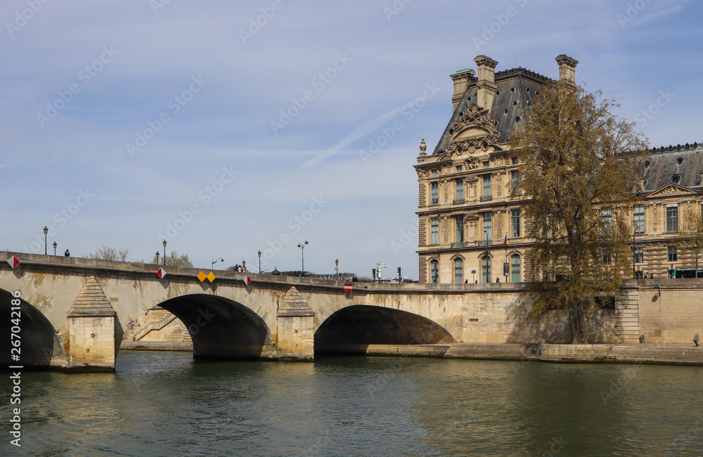 One of the oldest bridge ( Pont Royal ) across Seine River and  beautiful historic buildings of Paris France. April 2019